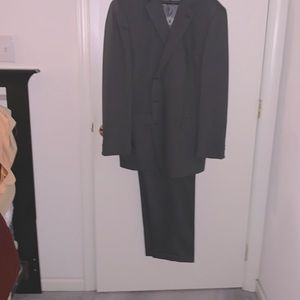 Men’s charcoal grey Perry Ellis suit. Never worn.  Alterations required.